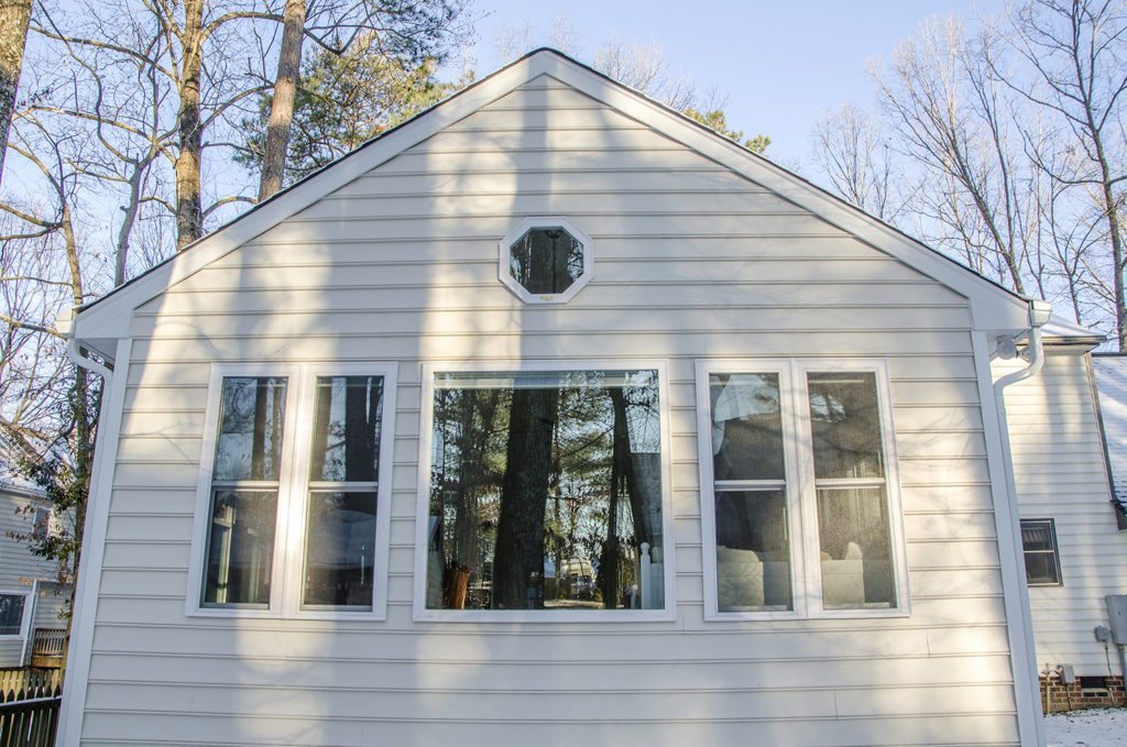 exterior of the sunroom addition with decorative window