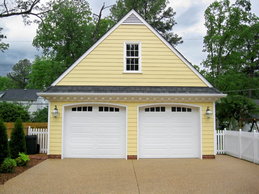 garage addition with an "A" roof and yellow siding